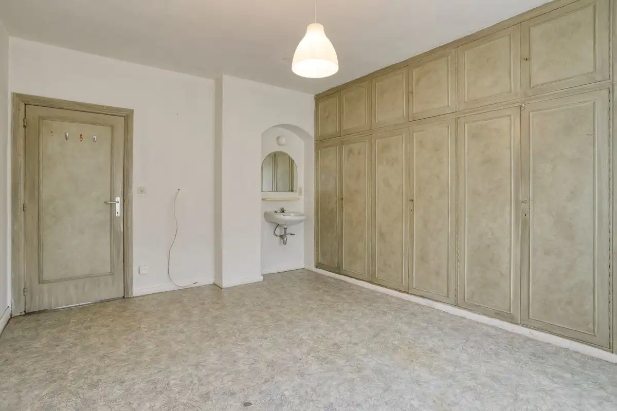 Op te frissen gelijkvloerse woning met 1 slaapkamer en garage! foto 8