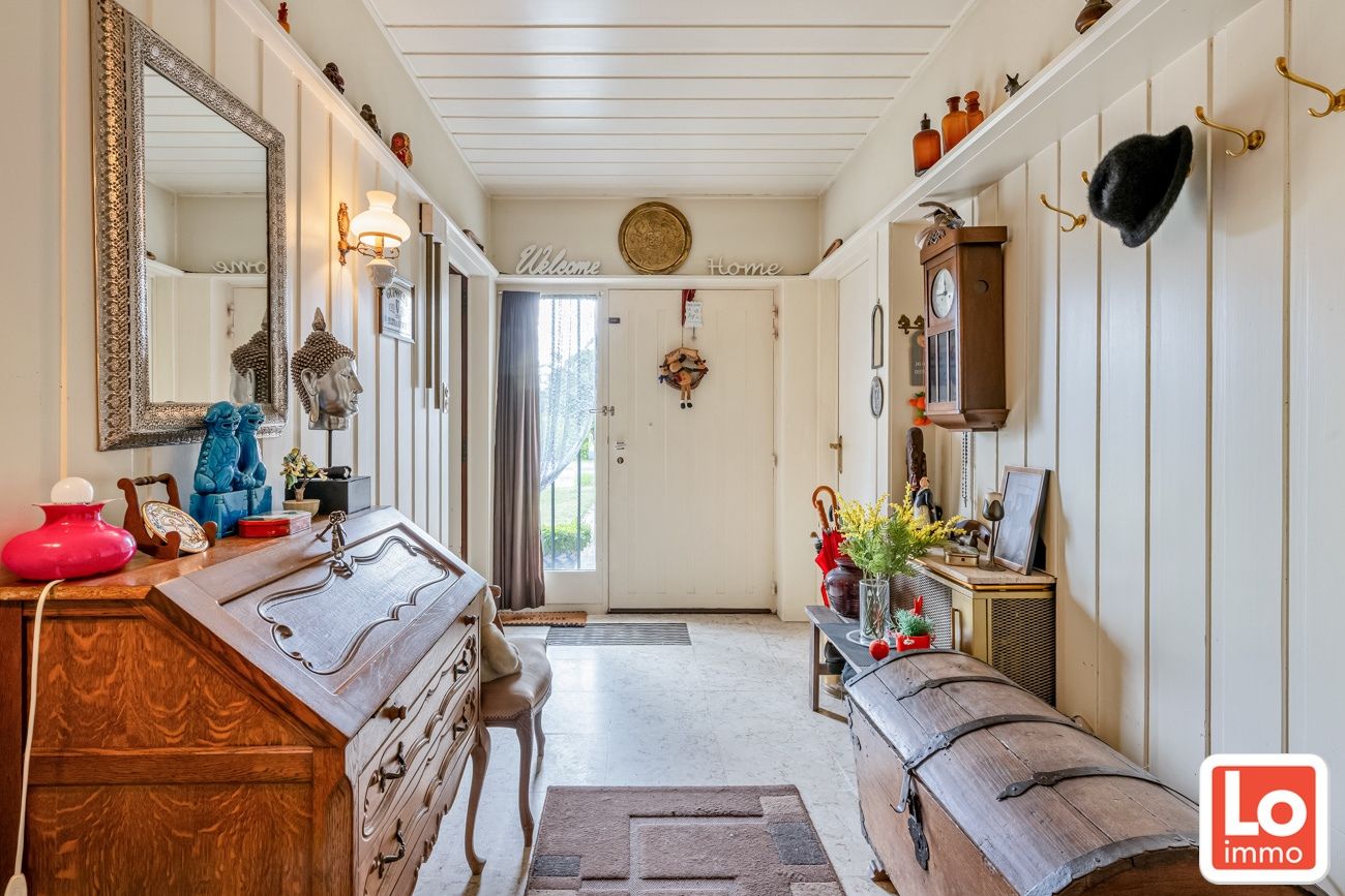 Te renoveren gelijkvloers woning met een open zicht op de achterliggende velden. foto 4