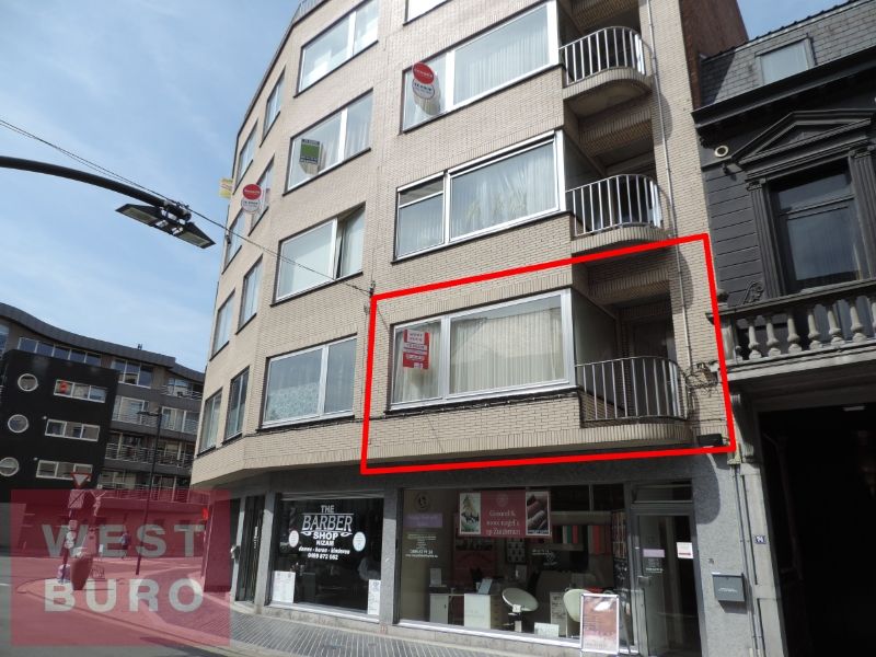 Zonnig 2-kamer appartement met garage centrum Roeselare foto {{pictureIndex}}