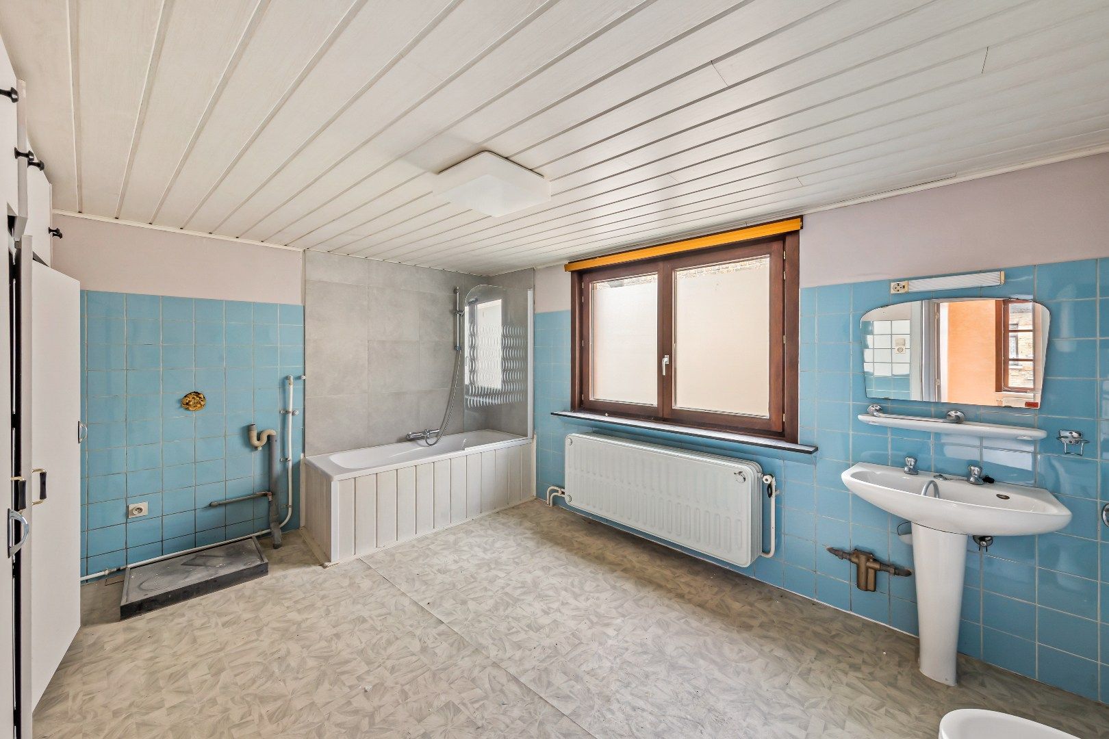Gezellige stadswoning met 4 slaapkamers, ruime garage en koertje. foto 5