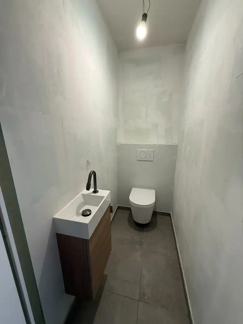 Instapklaar en energiezuinig gelijkvloers appartement met 1 slaapkamer en ruim terras te Riemst. foto 11