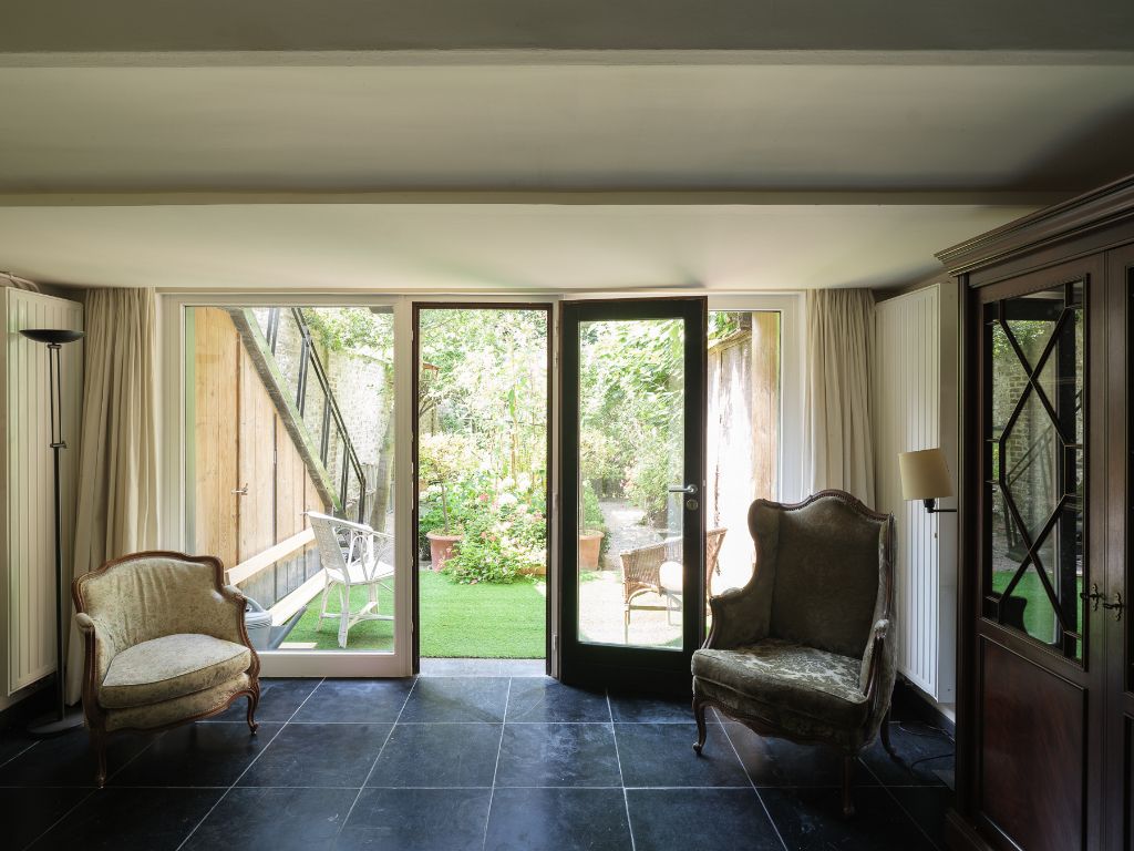 Karaktervolle burgerwoning met drie slaapkamers en een aangename, groene tuin op een uitstekende locatie in Gent. foto 21