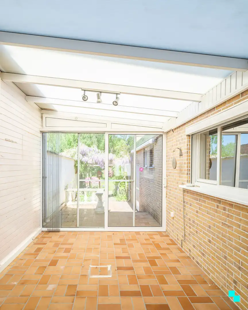 Te renoveren woning met gezellige tuin in het hart van Merelbeke foto 9