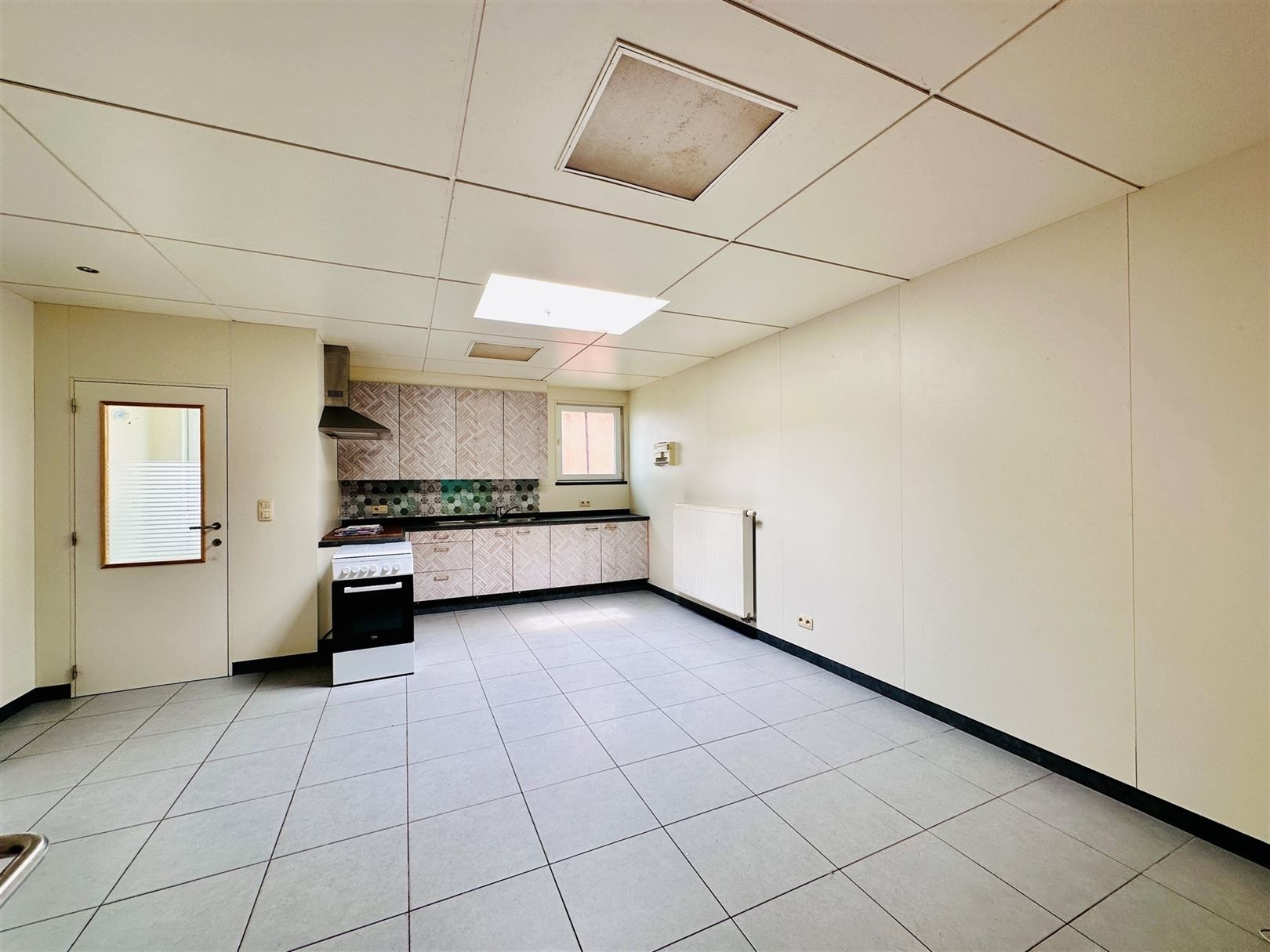 Ruime woning met diepe tuin in Grembergen met mogelijkheid tot handel of zelfstandige activiteit foto 7