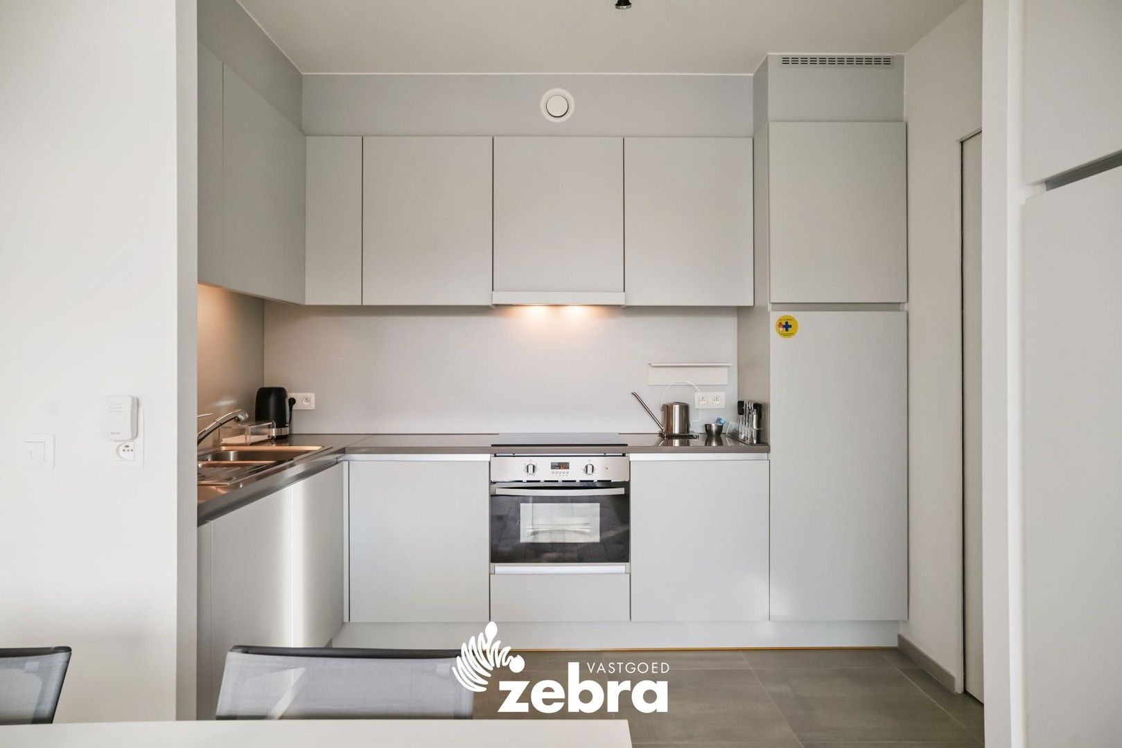 Moderne serviceflat met prachtig zicht op de Leie en autostaanplaats te Deinze! foto 5