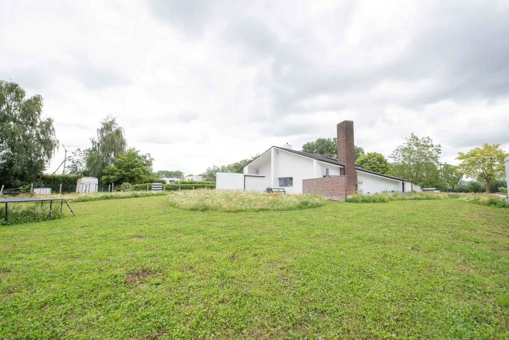 TE KOOP: Ruime architectenwoning in residentiële wijk 'De Piste'. Rustig, groen en zeer bereikbaar perceel van 1800m²! foto 24