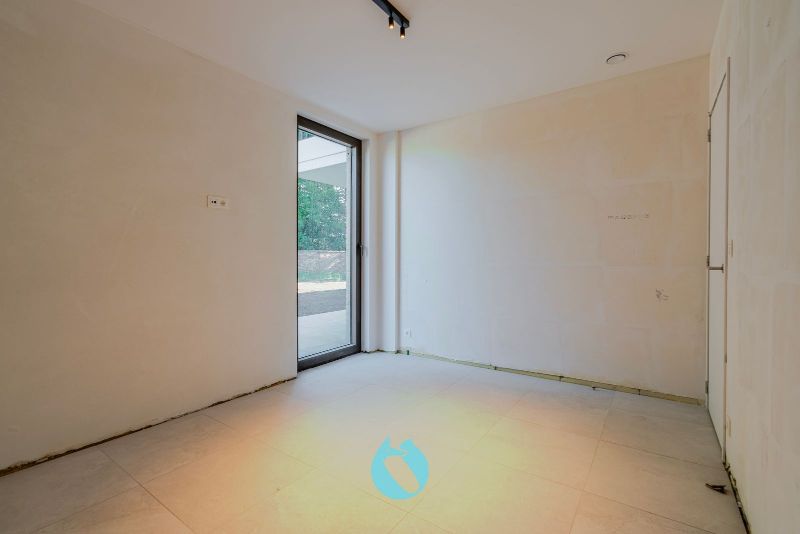 Green Square presenteert u 35 nieuwbouwappartementen en een winkelpand, letterlijk ónder de Kerktoren van Sleidinge. foto 5