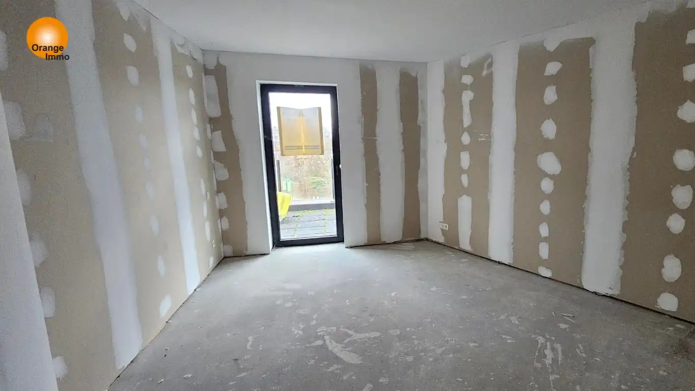 Nieuwbouwappartement met één slaapkamer gelegen in het commercieel en bruisend centrum van Eisden. Een appartement voor wie wil wonen in een gezellig en comfortabel complex voorzien van tal van faciliteiten. foto 5