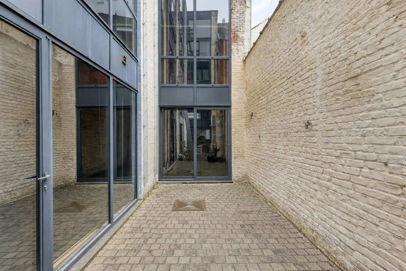 Industriële duplexloft met karakter in Gent foto 13