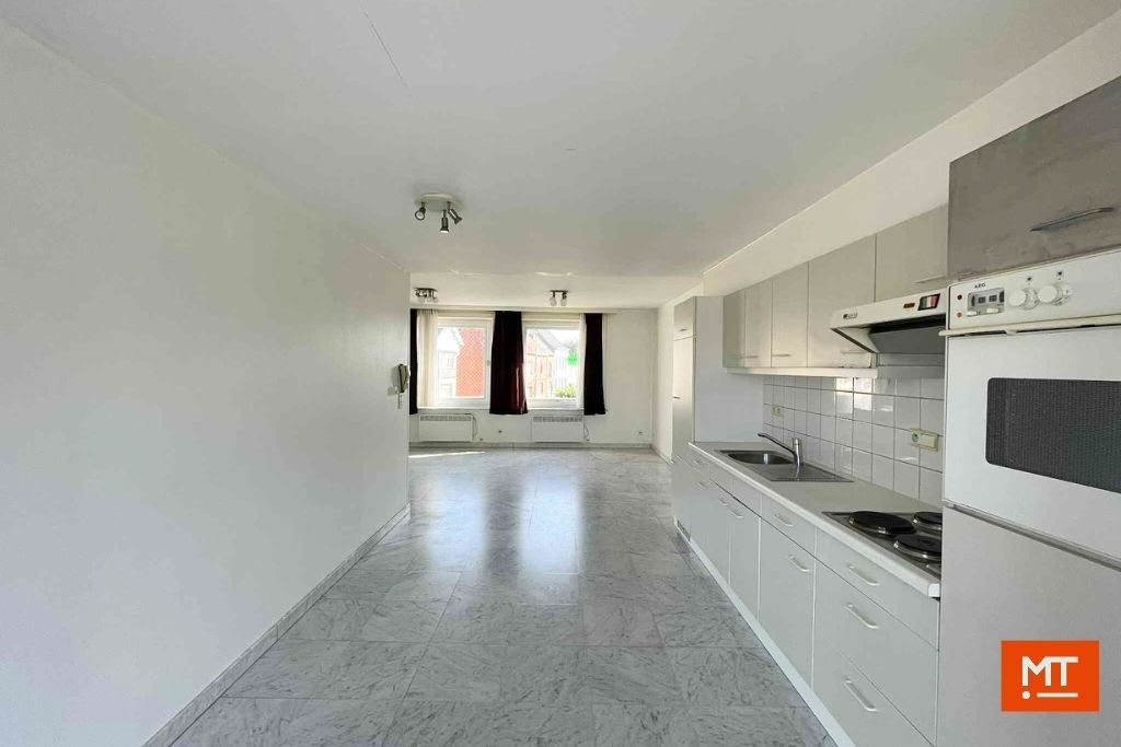 Veelzijdig gebouw bestaande uit handelsruimte, woning en appartement in het centrum van Wervik foto 21