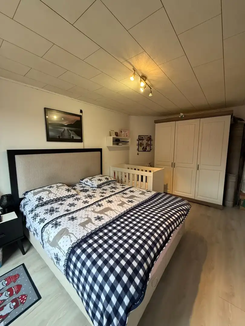 Opbrengsteigendom bestaande uit 2 halfopen woningen met garage en tuin te Hechtel. foto 34