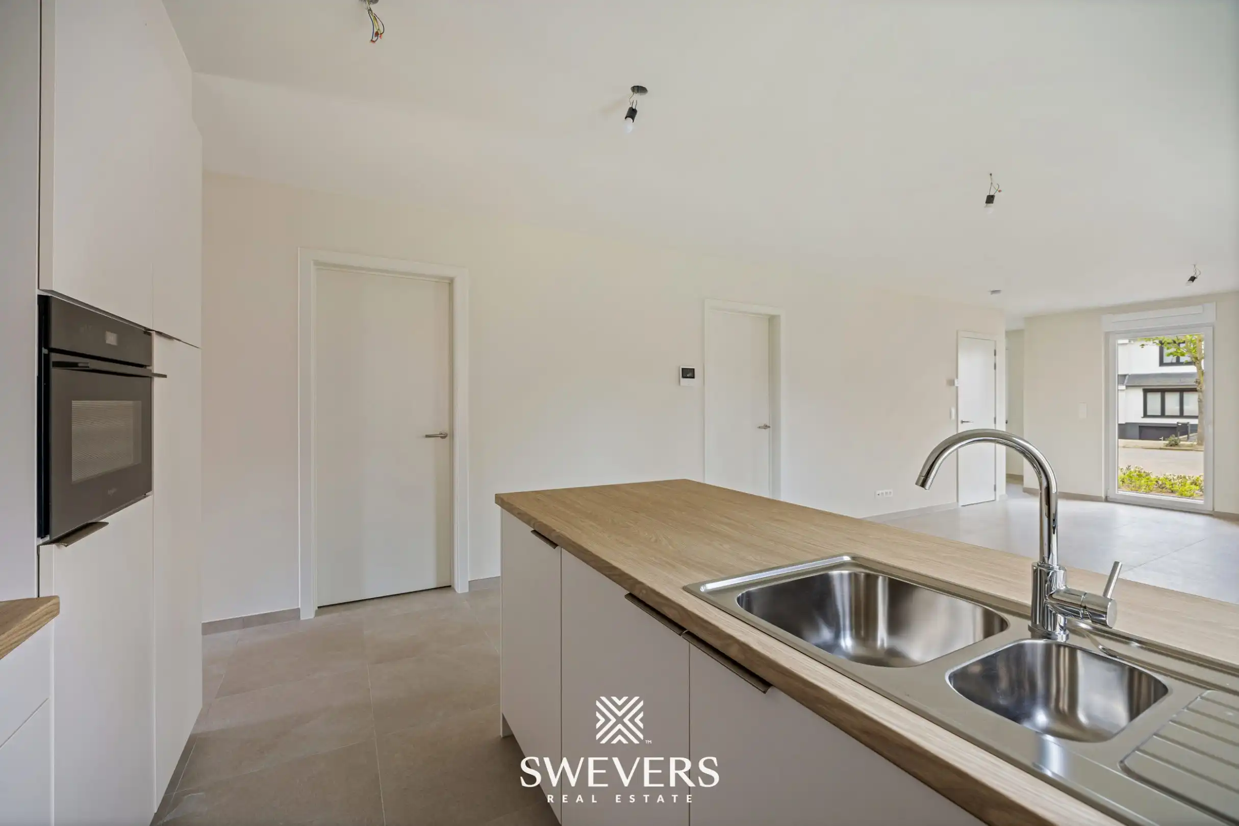 Modern gelijkvloers appartement met privétuin en dubbele parking foto 5