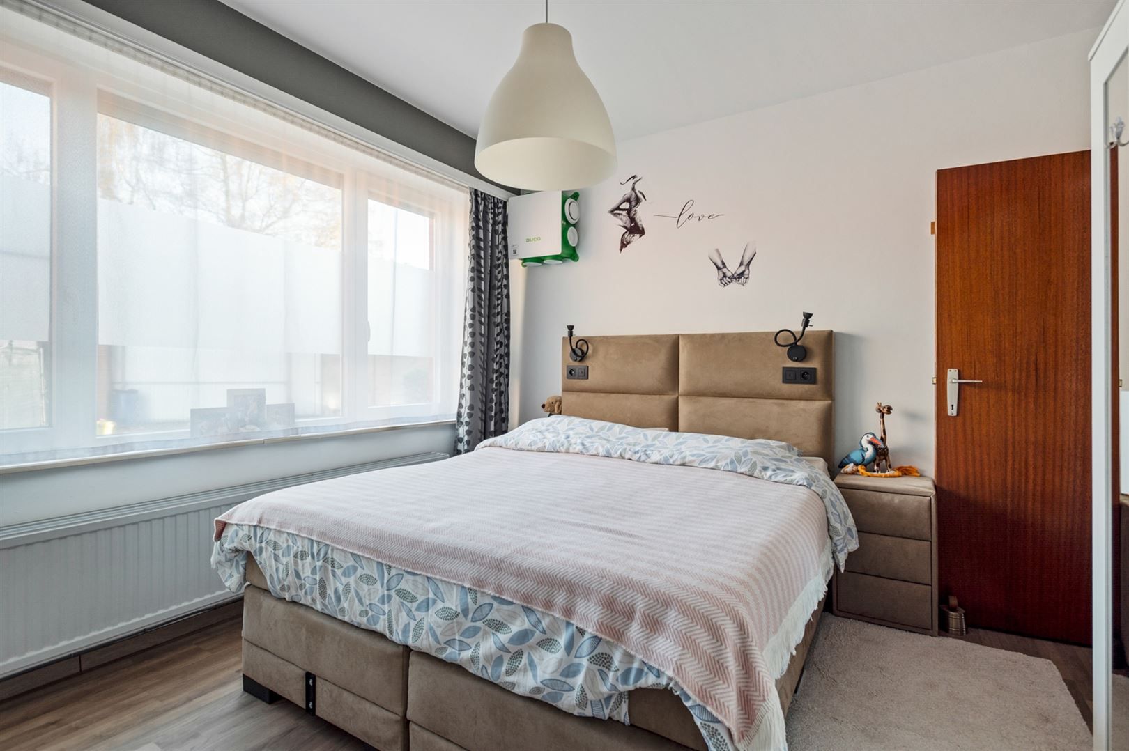 Rustig gelegen gelijkvloers appartement met 2 slaapkamers en garage. foto 8