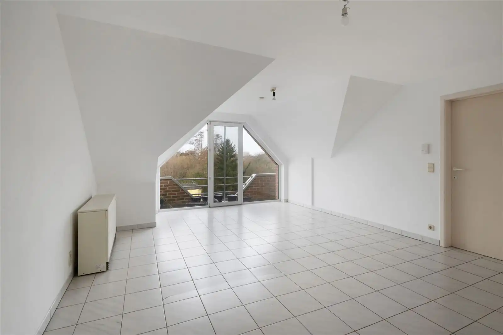 Lichtijke penthouse met terras en garagebox foto 2