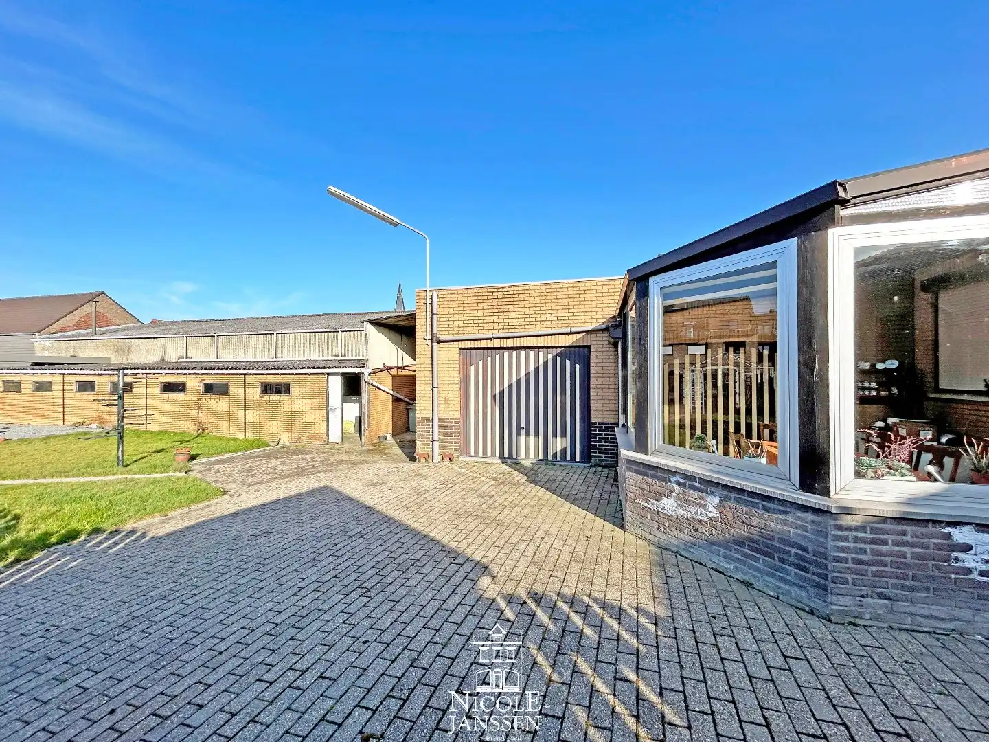 Verzorgde gelijkvloerse woning met tuin in verzorgde straat in centrum van Dilsen foto 21