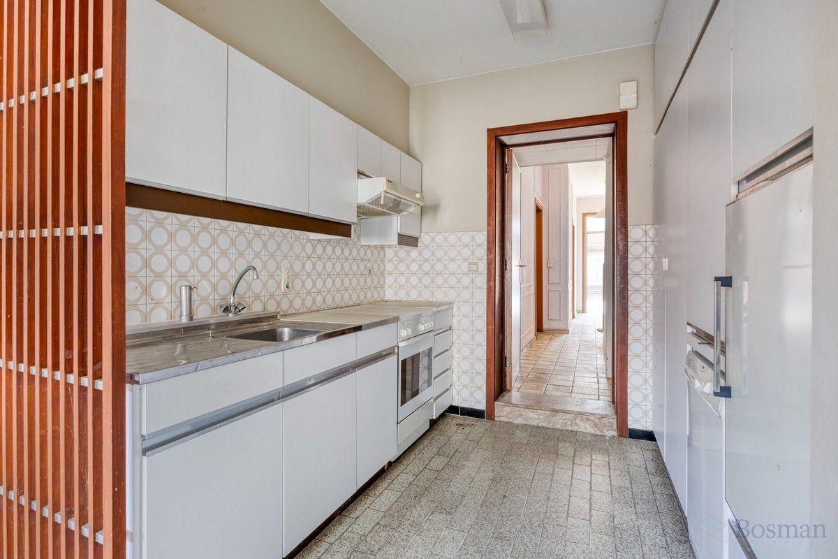 Te renoveren woning met 5 garageboxen te koop in Ham foto 6