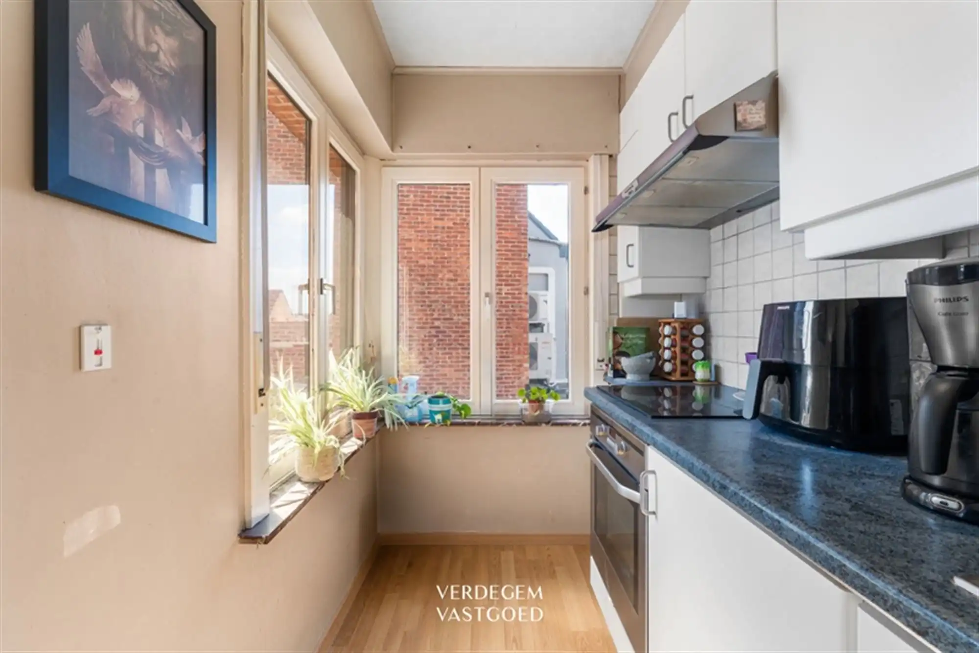 Opbrengsteigendom met 2 appartementen en 4 garages in het centrum van Sleidinge  foto 7