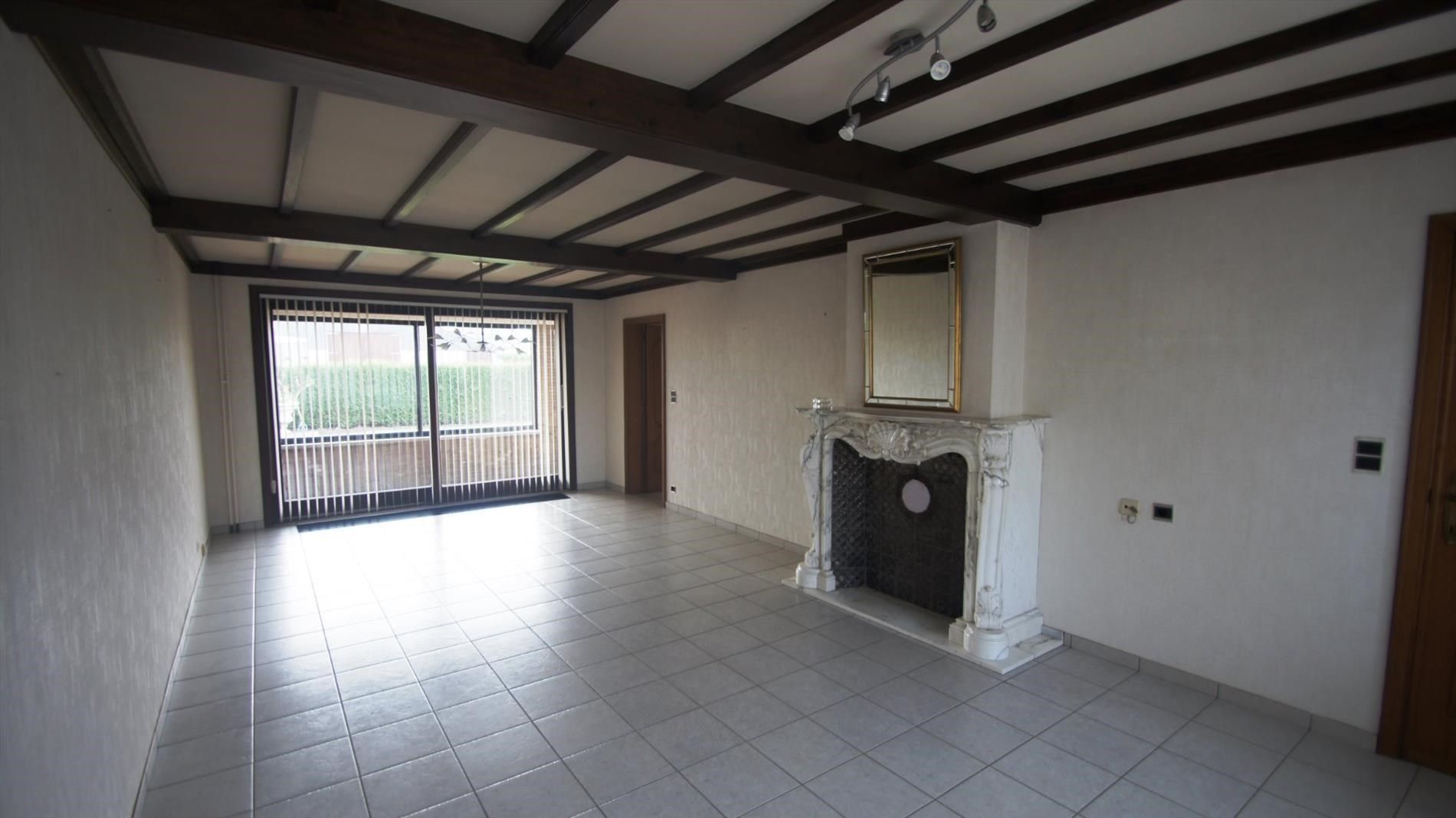 Ruime woning met 2 slpks en mooie tuin foto 3