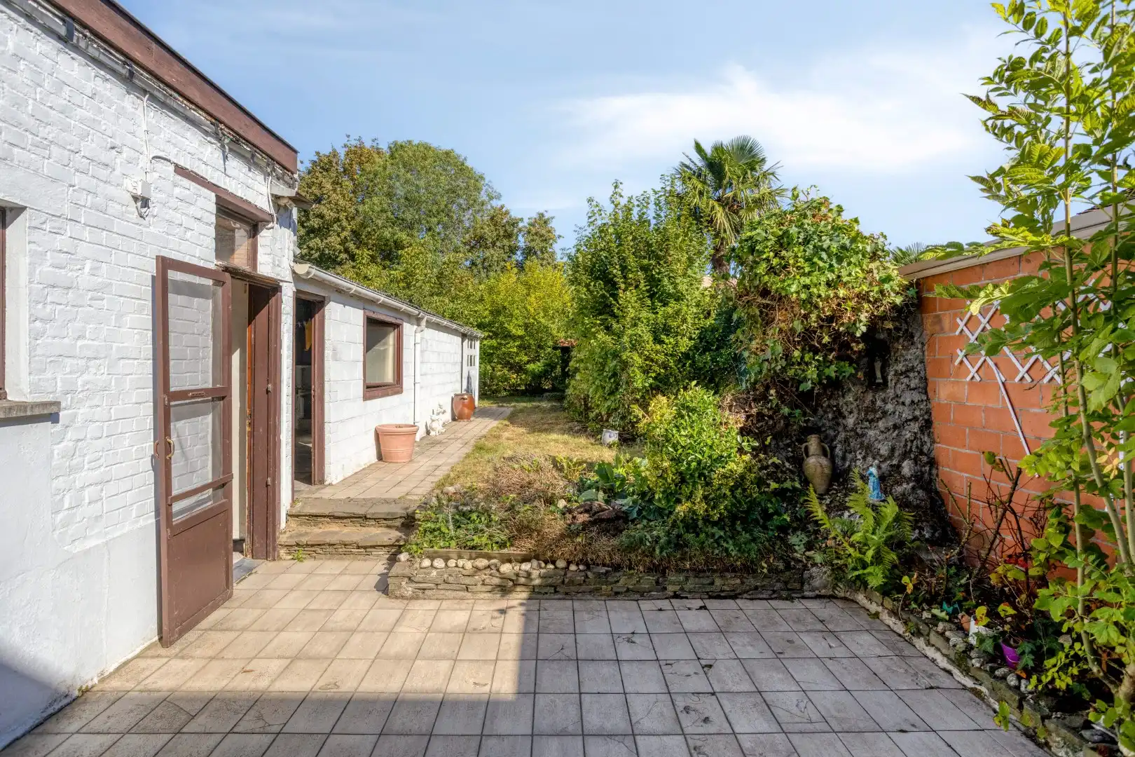 Karaktervolle te renoveren woning met diepe tuin in hartje Wevelgem foto 22