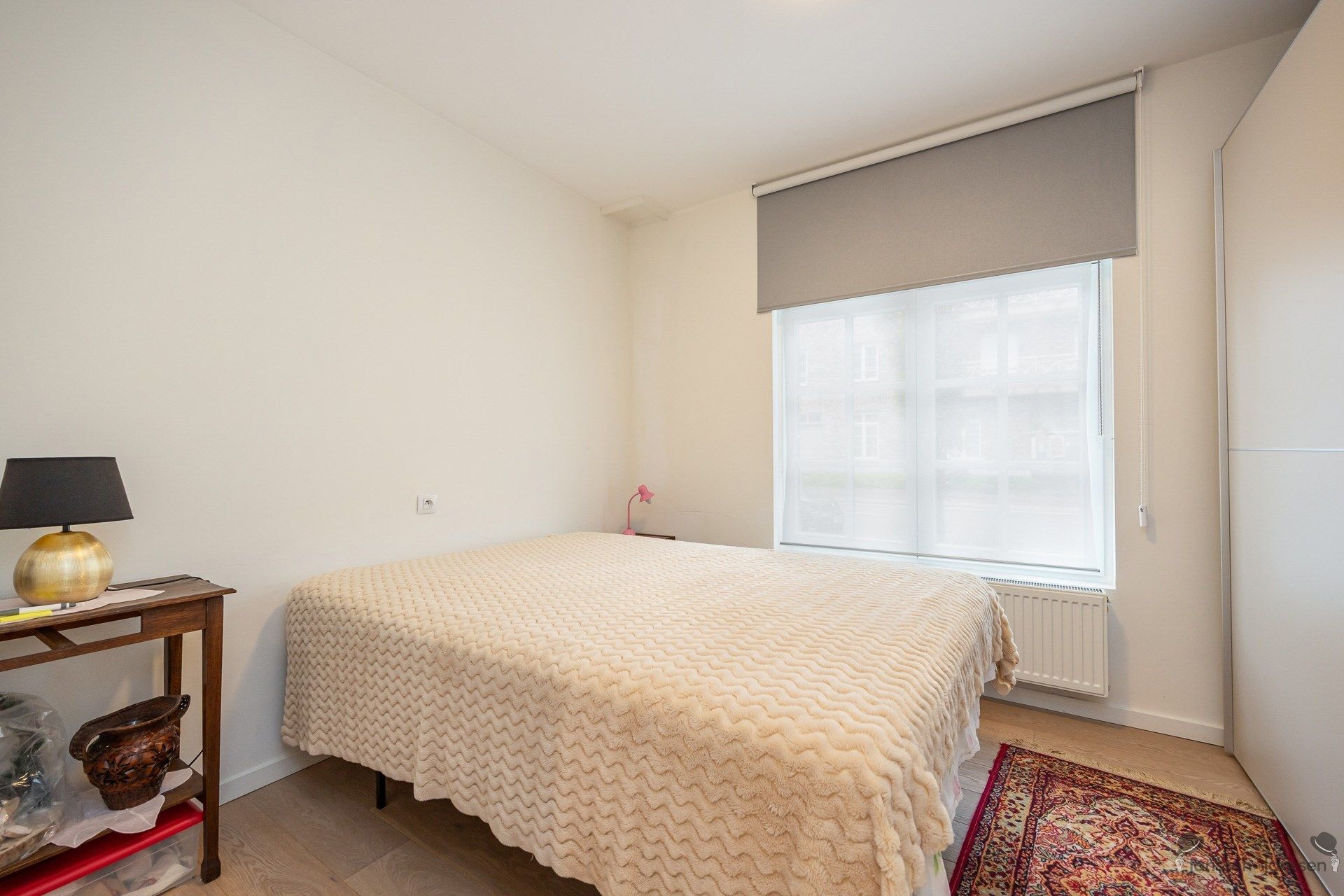 Instapklaar gelijkvloers appartement met tuin en 2 autostaanplaatsen foto 11