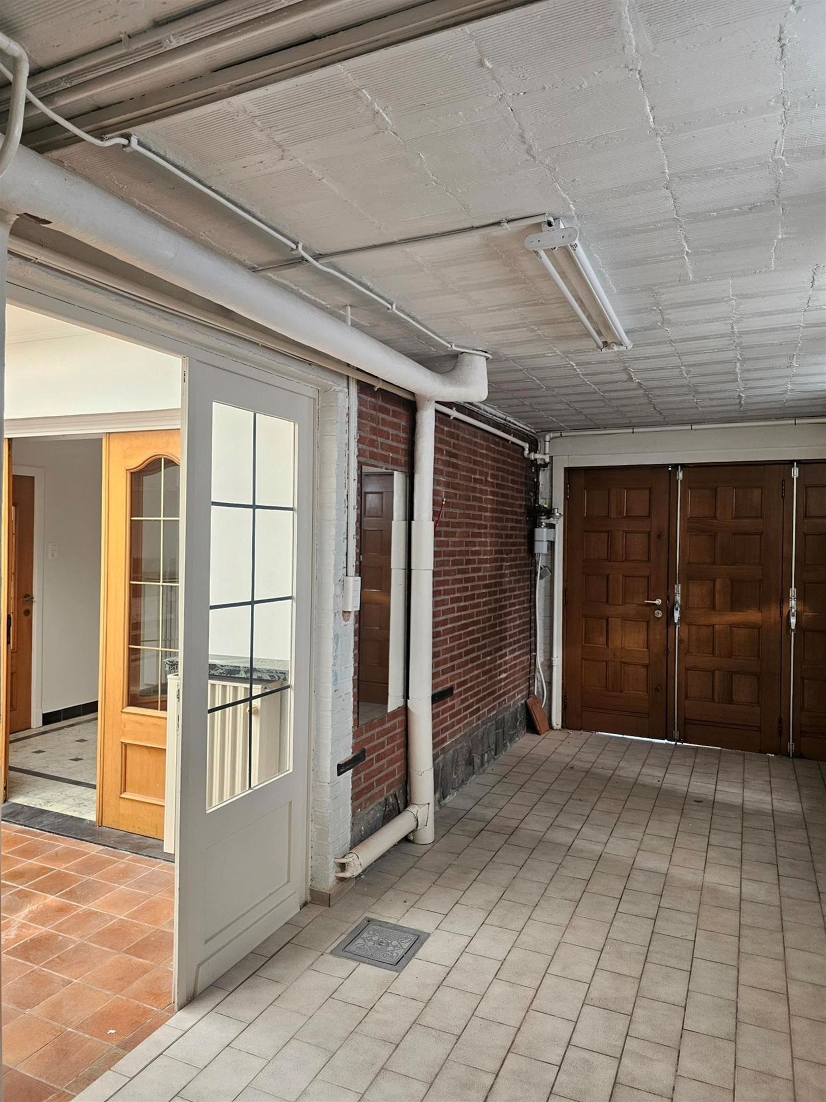 Half-open bebouwing met garage en tuin foto 7
