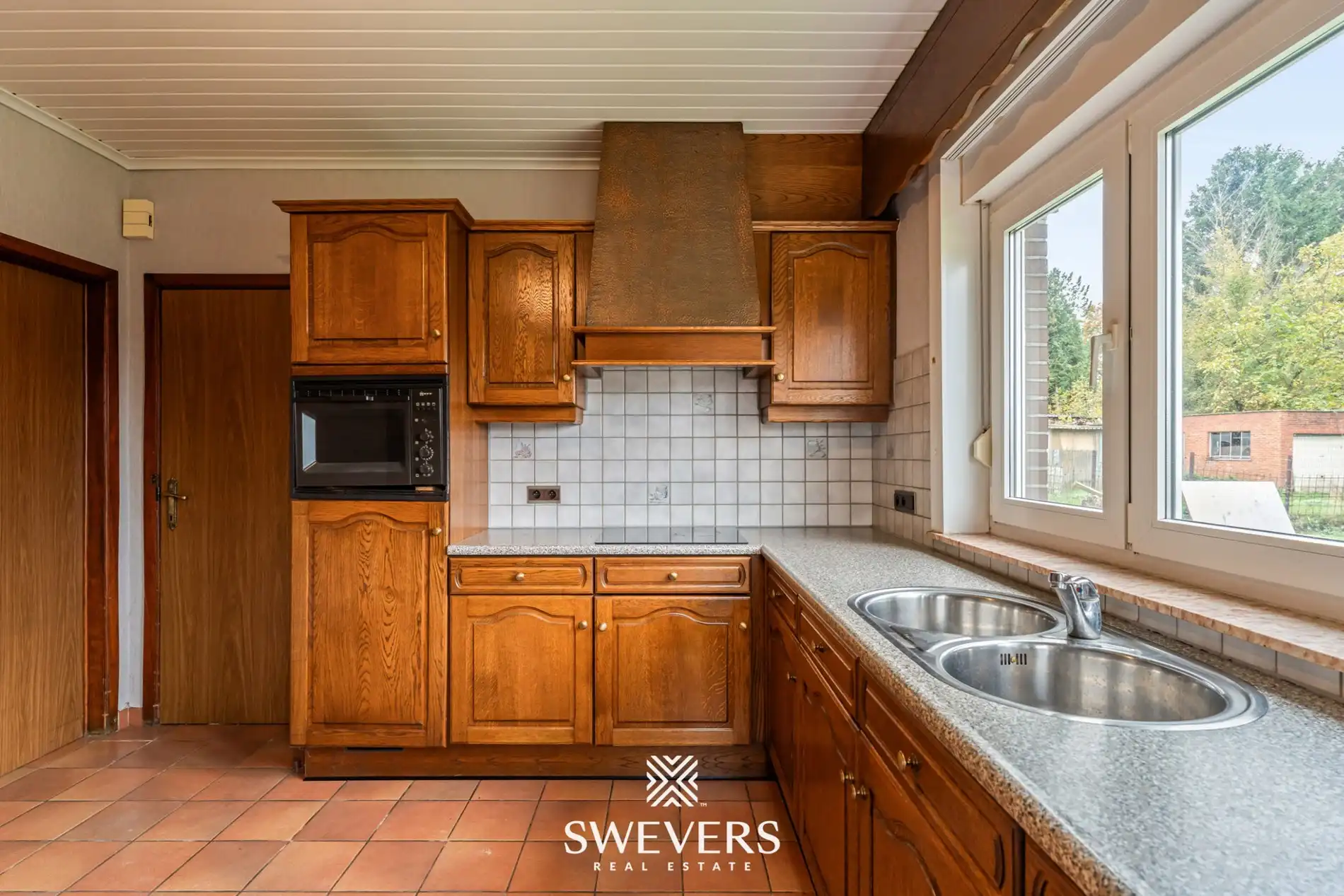 Ruime open bebouwing met potentieel en zuidgerichte tuin in rustige wijk van Houthalen foto 9