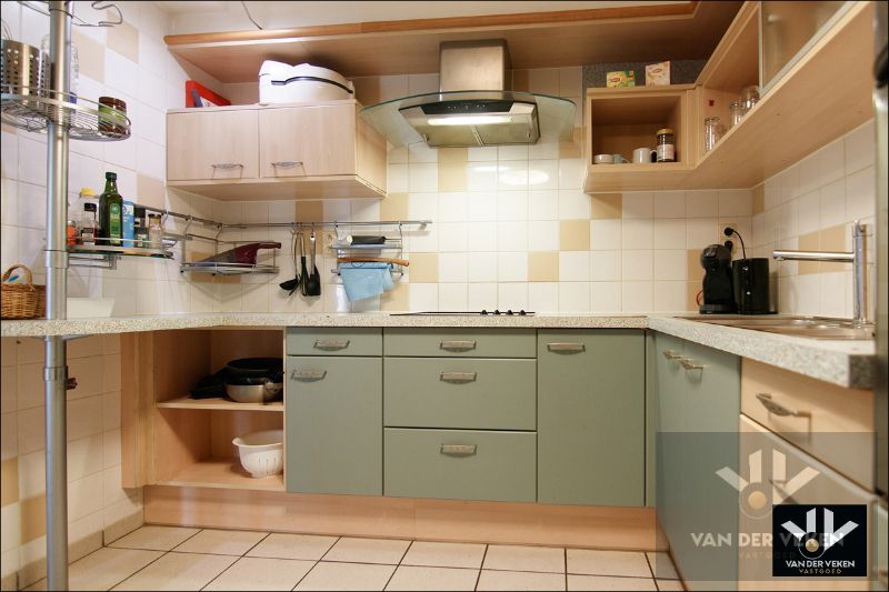 Instapklaar gelijkvloers appartement met ruime tuin te Tuilt foto 7