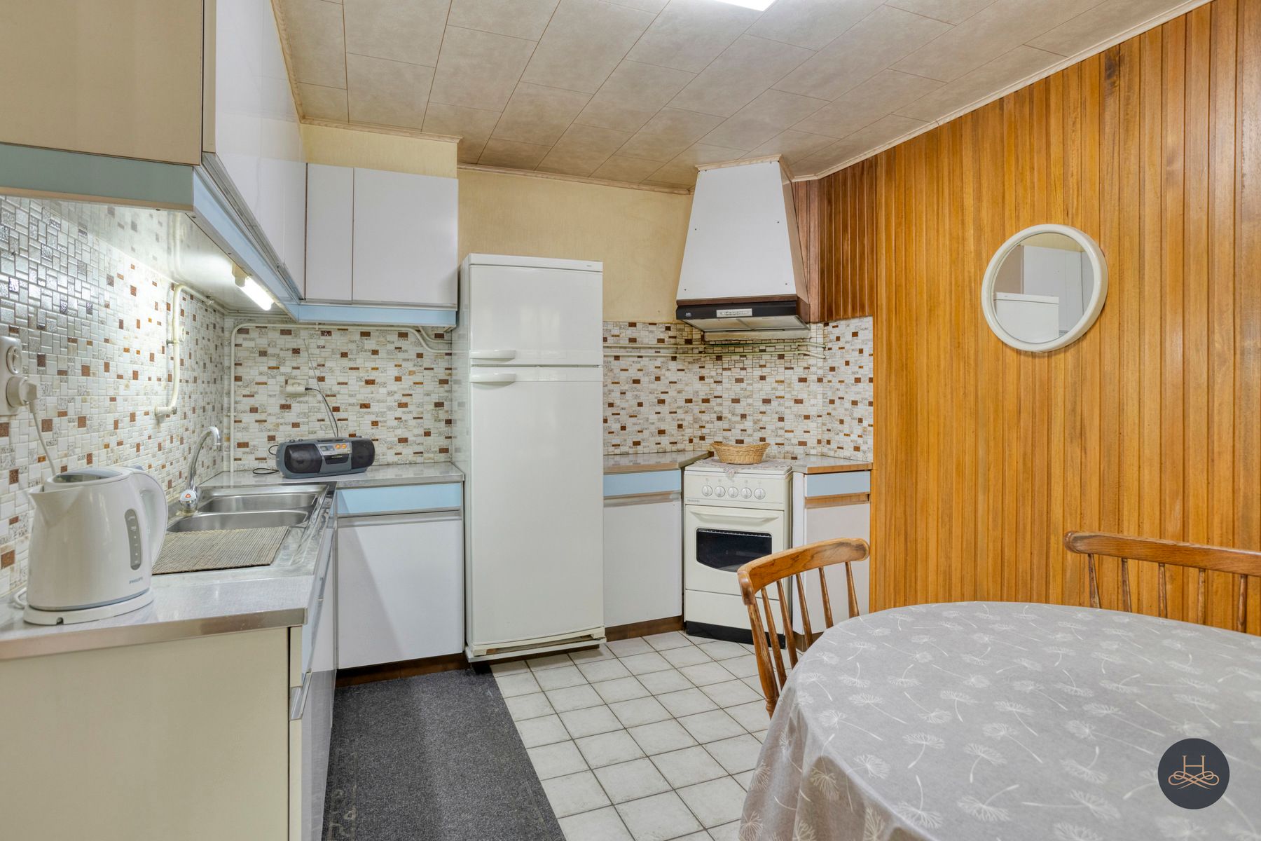 Halfopen woning met tuin en renovatiepotentieel foto 9