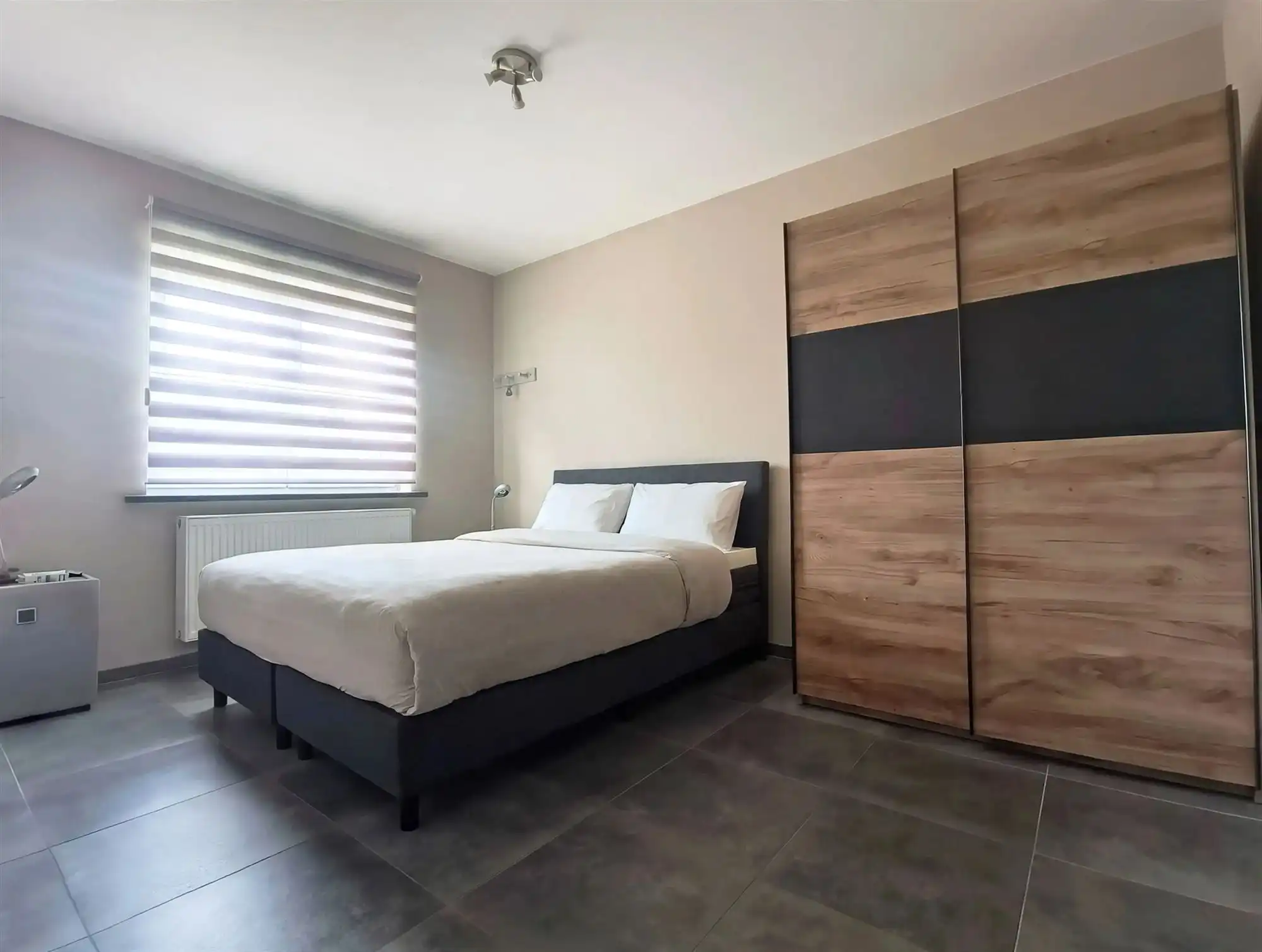 Appartement - Gelijkvloers - met 2 slaapkamers, groot terras en ondergrondse autostaanplaats foto 12