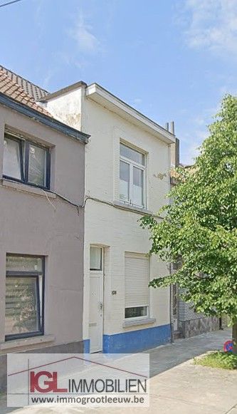 Huis met ruime tuin te koop in Anderlecht foto {{pictureIndex}}