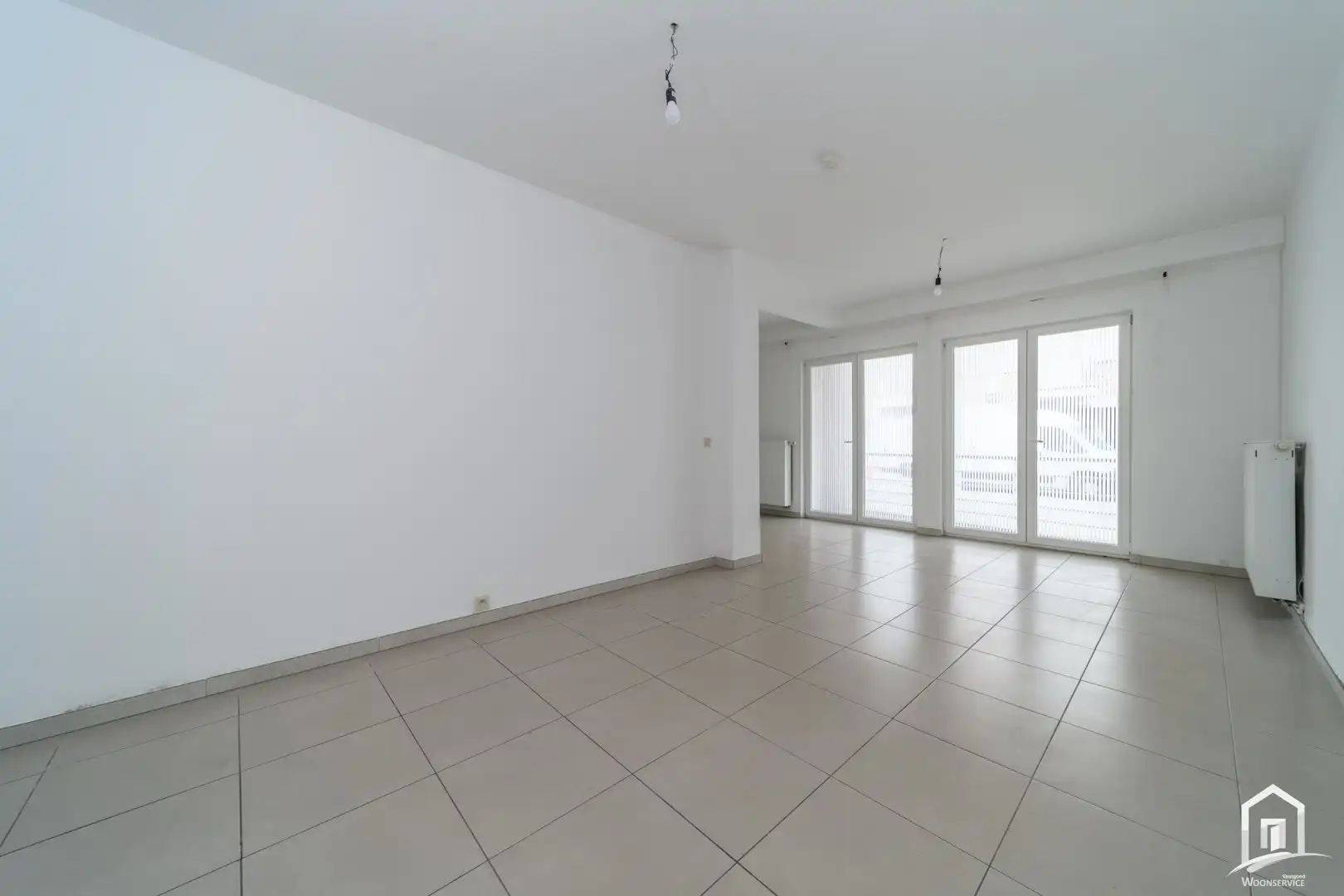 Ruim en energiezuinig gelijkvloersappartement met terras en autostaanplaats foto 6