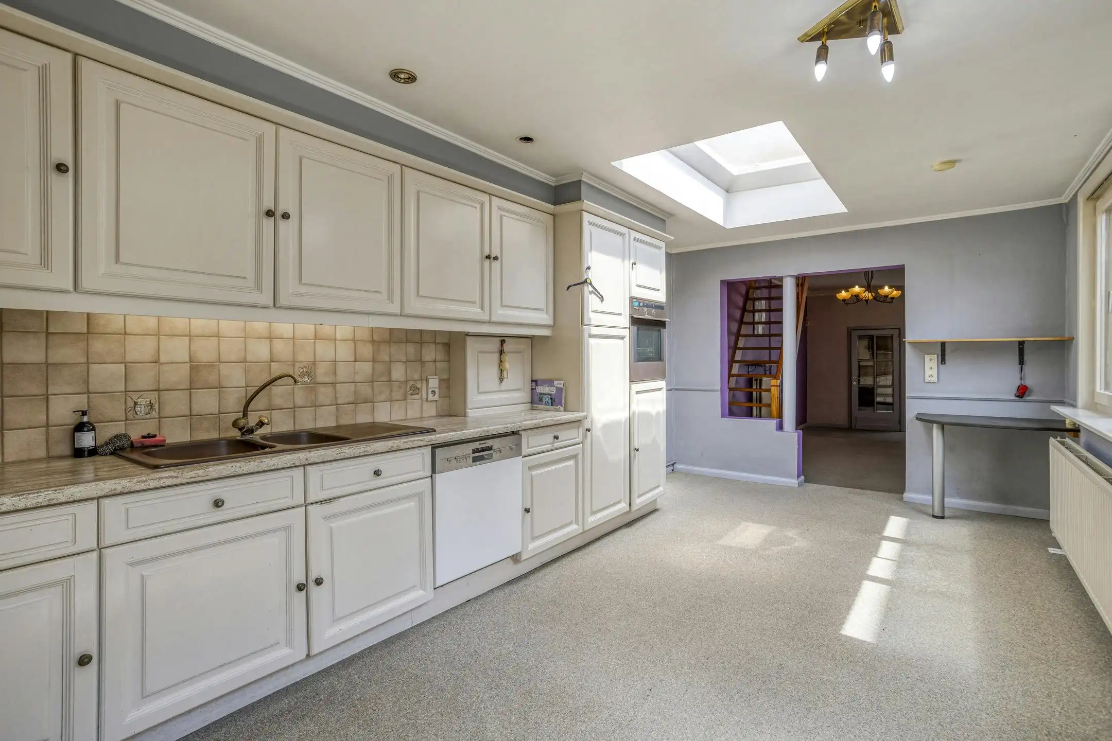 Te renoveren huis met vier slaapkamers en tuin in Kruibeke foto 6