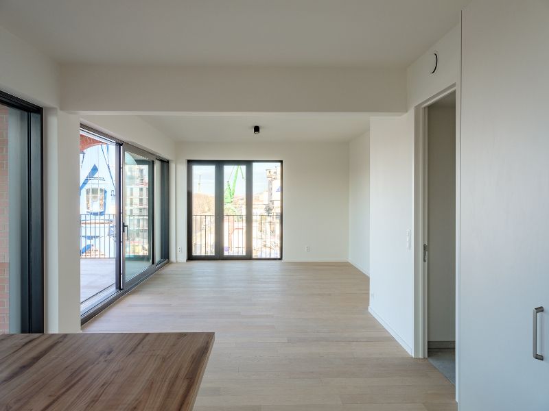 Ruim 2slpk-appartement met zuid-west georiënteerd terras aan de ‘Nieuwe Dokken’. Een appartement met een fenomenaal zicht over het water en de Gentse skyline! foto 7