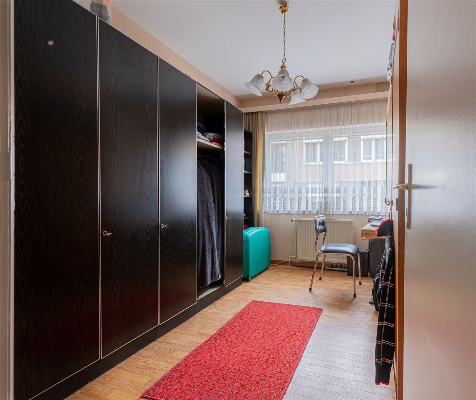 Gelijkvloers 2-slaapkamerappartement met tuin en garage foto 7