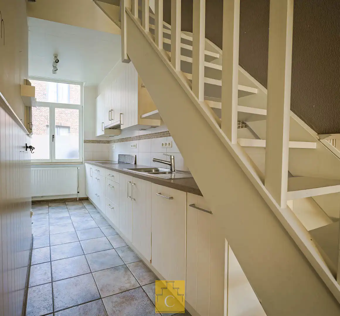 Instapklare trapgevelwoning met zonnig terrastuintje en grote berging, centrum, rustige straat omgeving ’t Zand foto 15