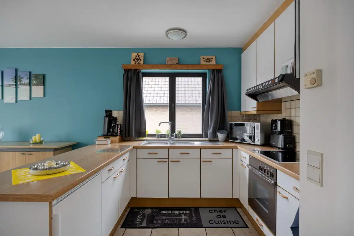Opbrengsteigendom met 3 appartementen en 7 garages foto 25