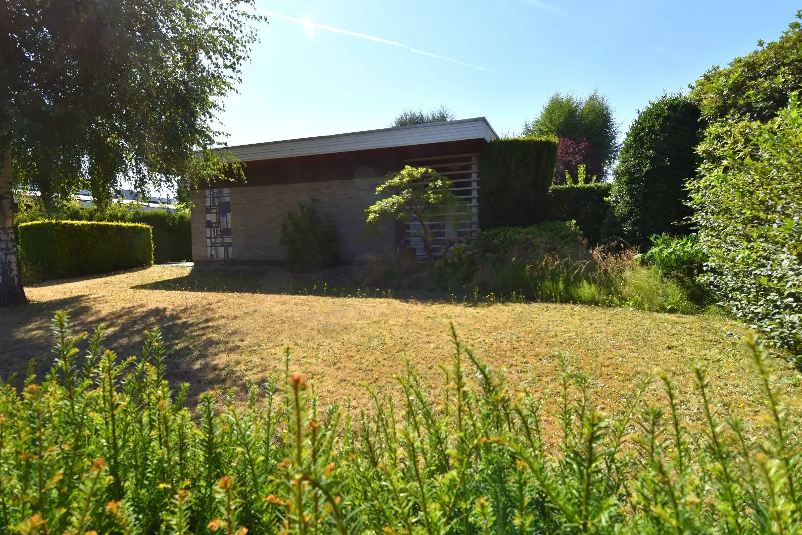 Alleenstaande woning met achterliggende opslag ruimte (205 m²) te koop in Heule foto 3