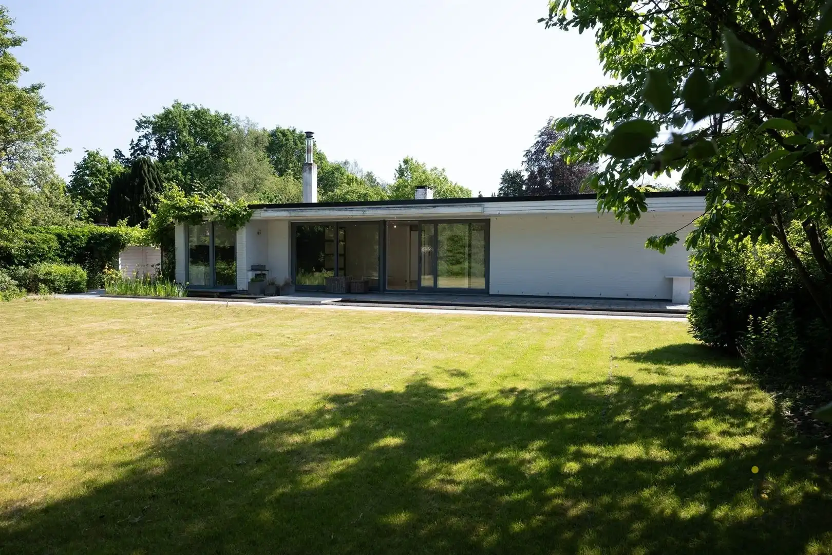 Te renoveren zonovergoten gelijkvloers 70’s woning met prachtige tuin en tal van mogelijkheden! foto 46