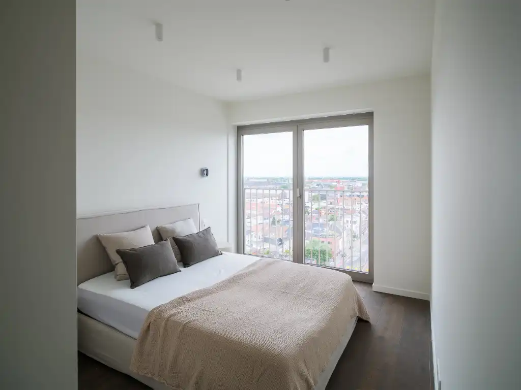 Penthouse met twee volwaardige slaapkamers en een uitzonderlijk terras met panoramisch zicht over Gent en zijn torens. foto 17