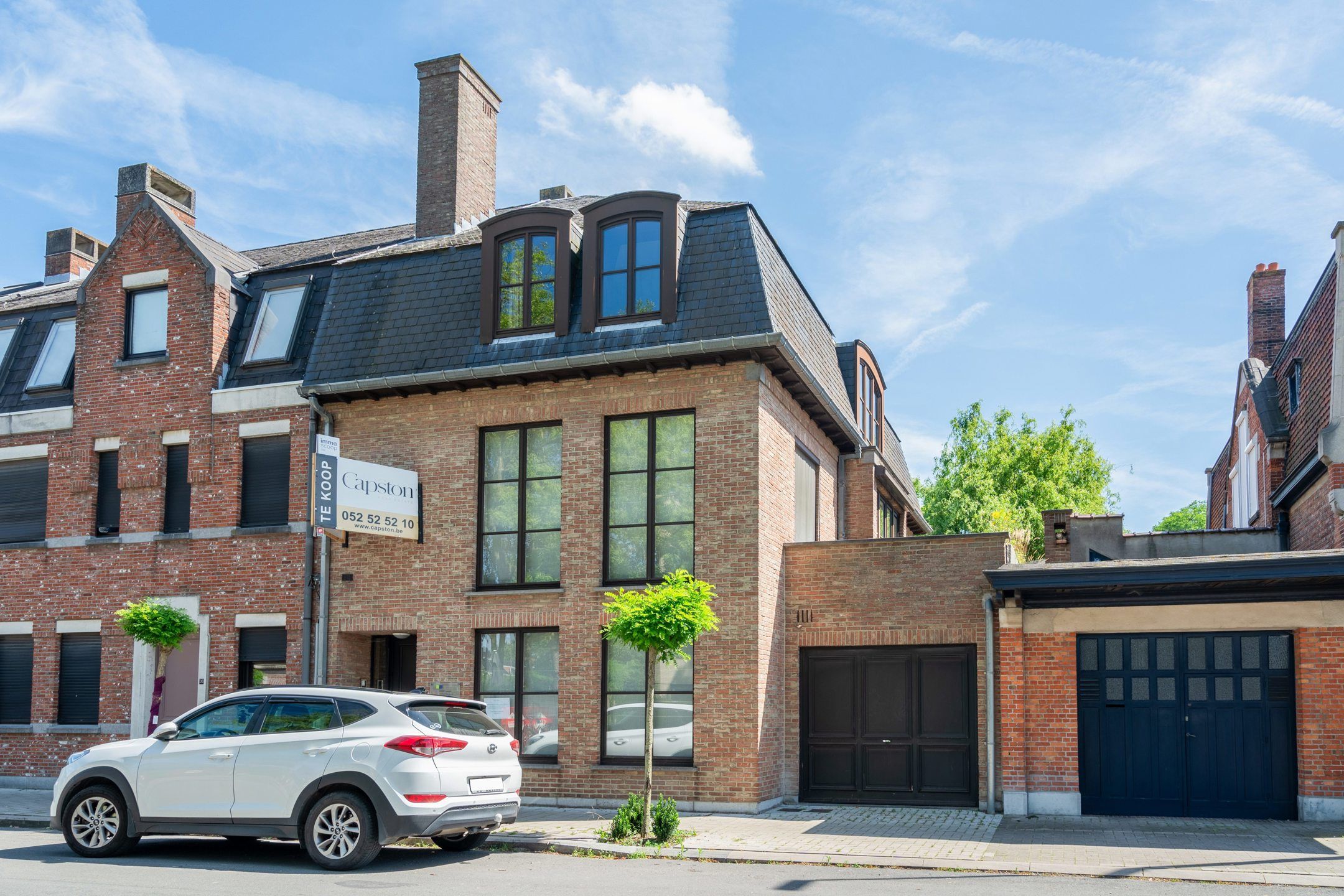 Enorm ruime woning met tuin, garage en parking achteraan.  foto 1