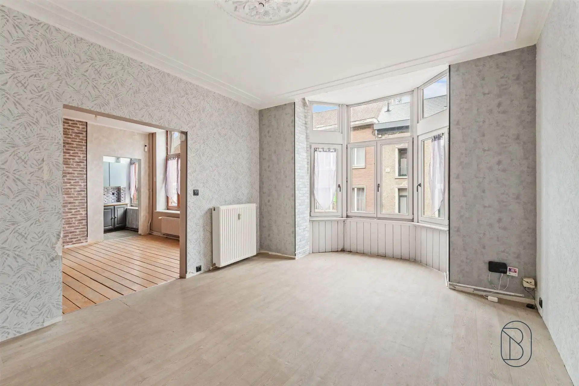 Opbrengsteigendom: handelsruimte en 2 appartementen foto 9