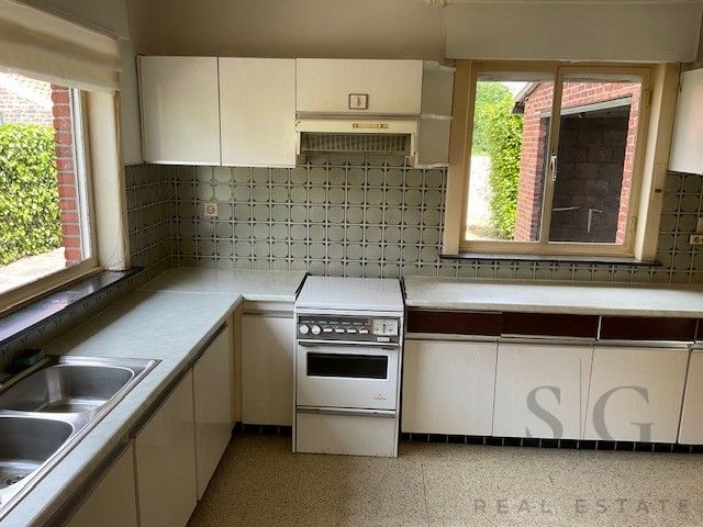 Te renoveren vrijstaande woning op ruim perceel tussen Bocholt en Bree – rust en potentieel op meer dan 32 are foto 2