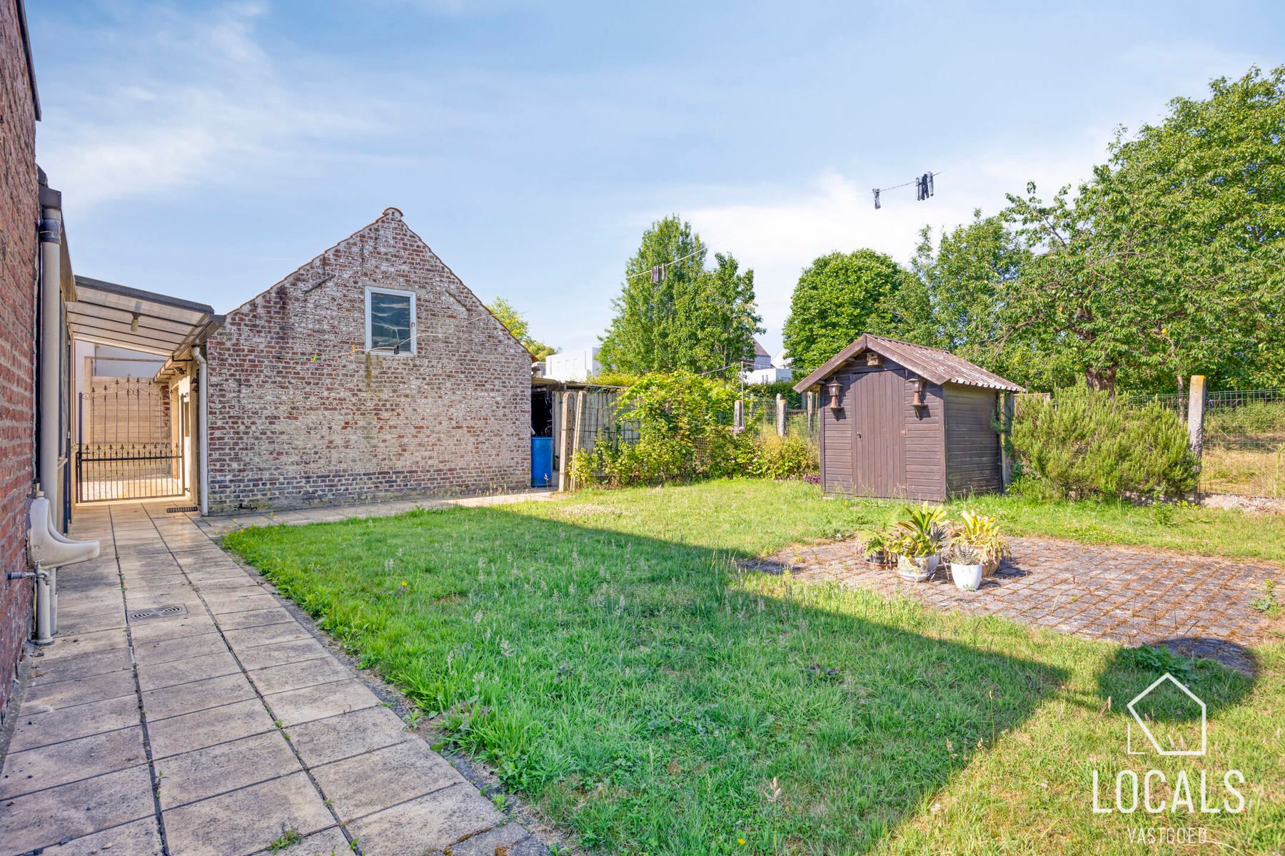Open bebouwing met 3 slpks, garage, opslagruimte & tuin foto 26