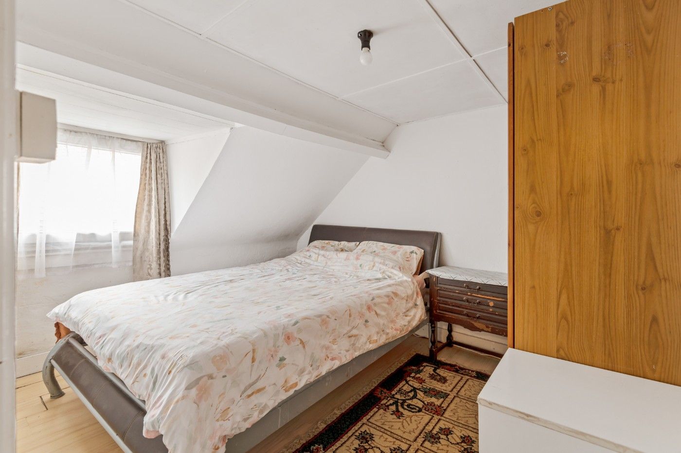 Te renoveren woning met 3 slpk. en tuin foto 15
