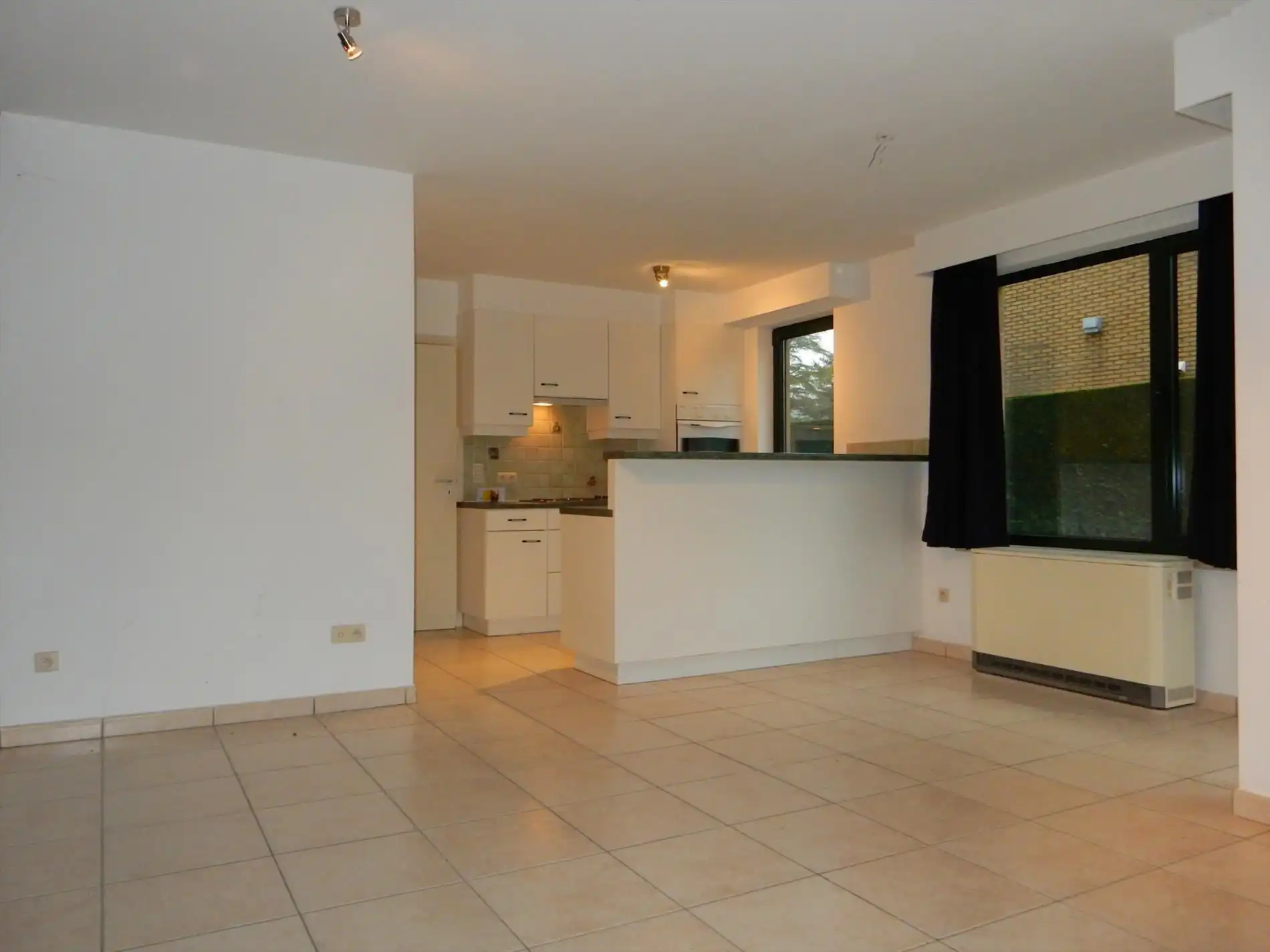 Gezellig gelijkvloersappartement met zonnige tuin en garage foto 4