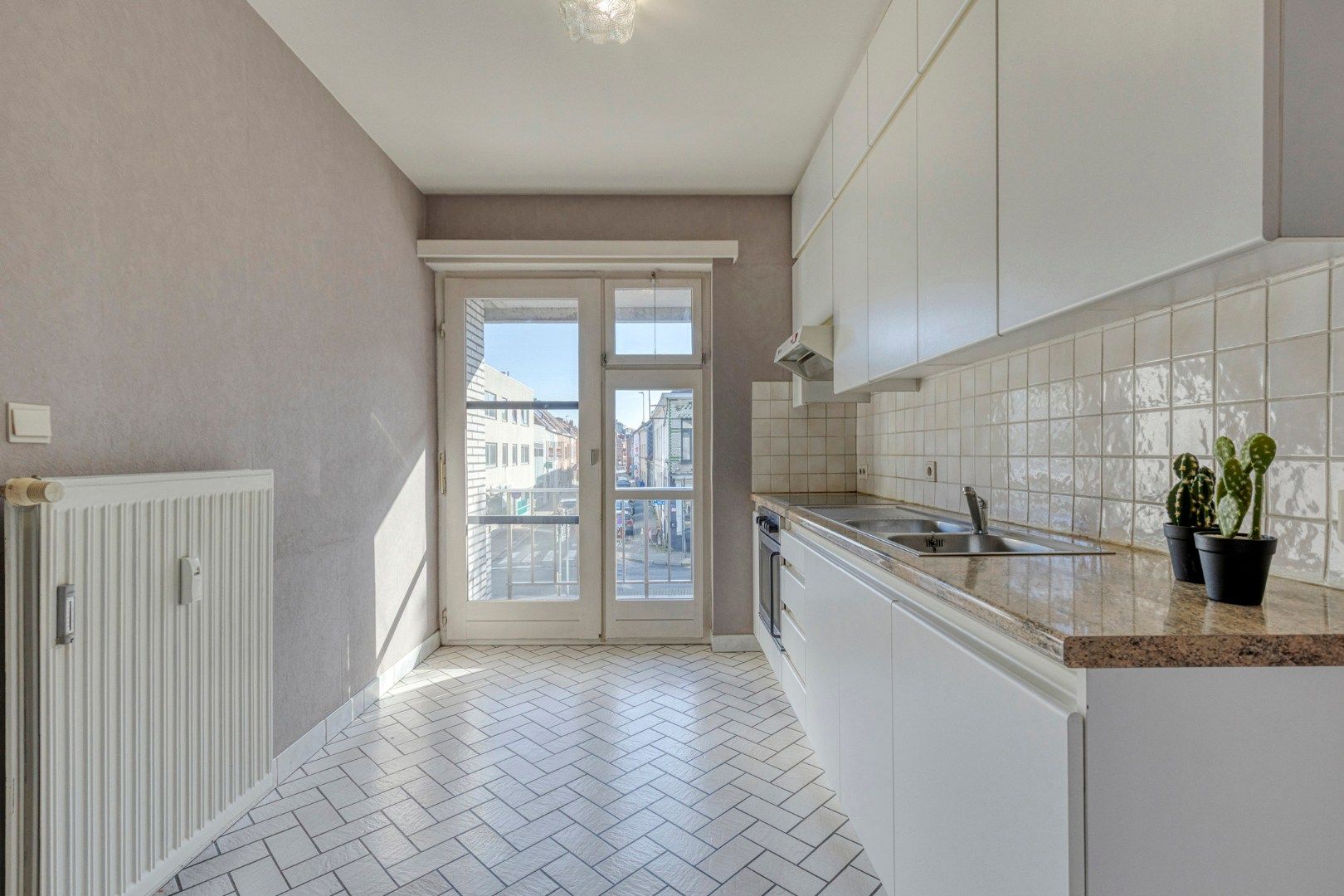 CENTRUMLIGGING - Lichtrijk appartement MET garage foto 4