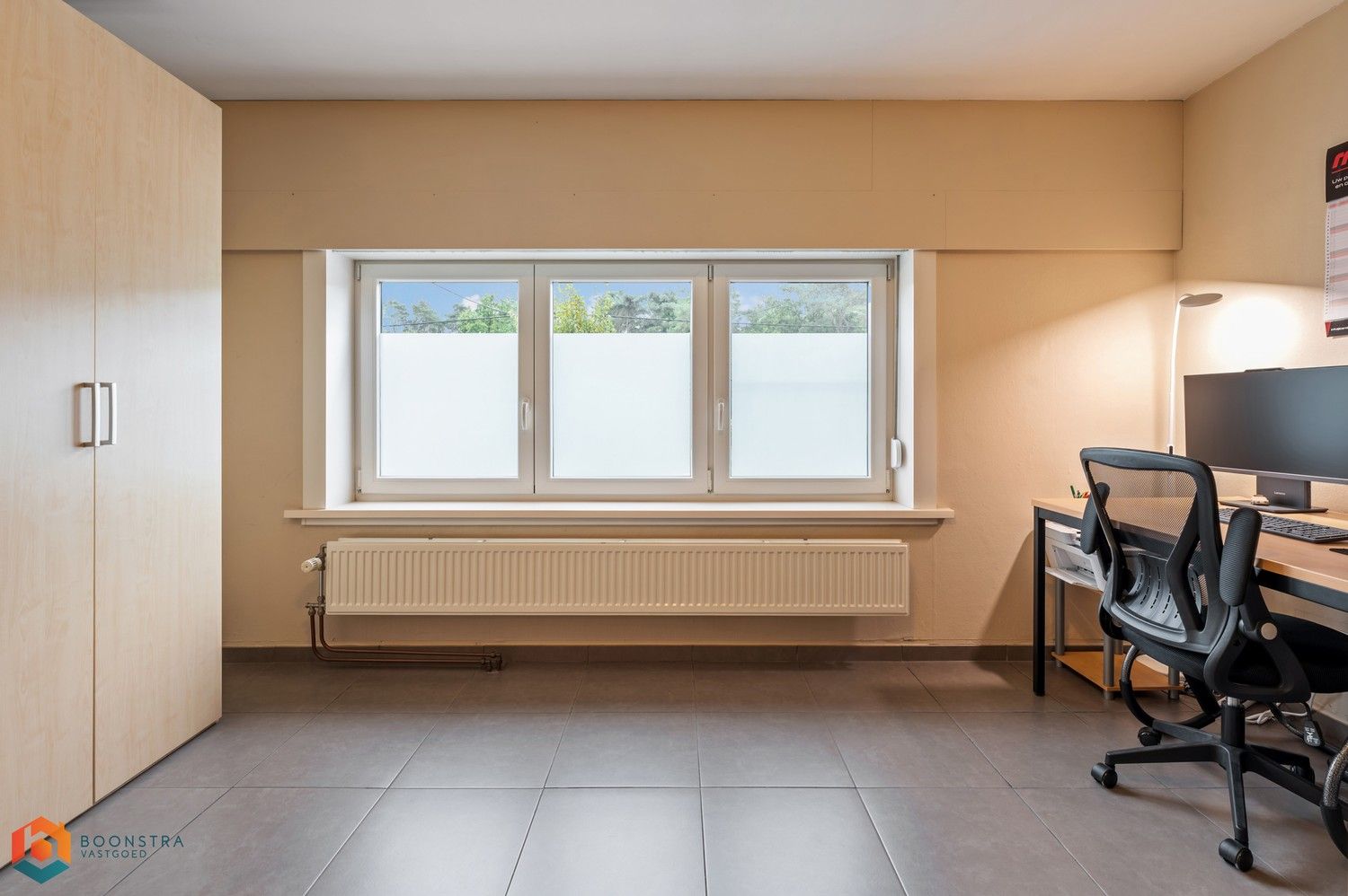 Verzorgde woning met 2 slpkrs, leuke tuin en garage foto 18