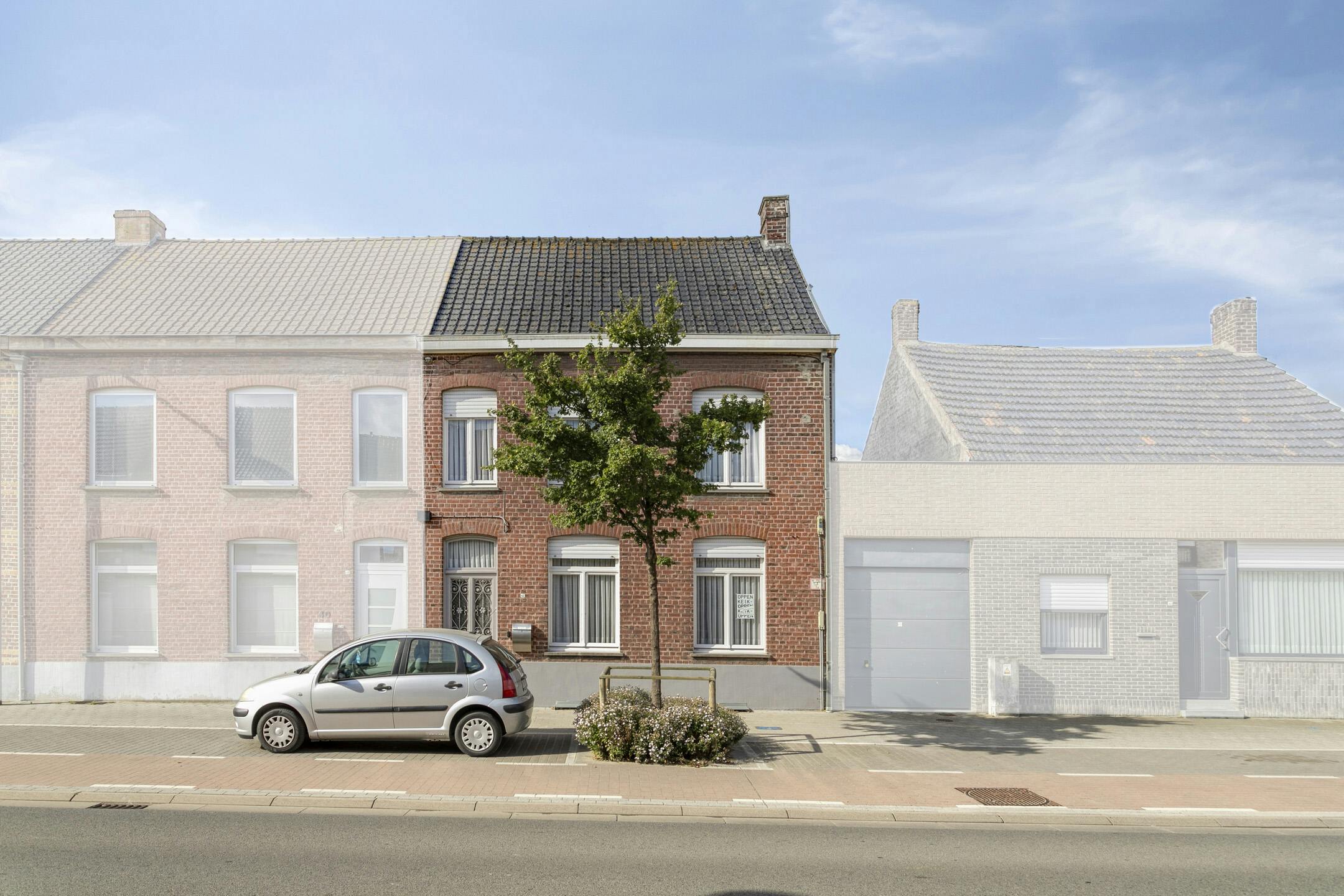 Karaktervol huis met zonnige tuin, 3 slaapkamers én garage met uitweg foto 2