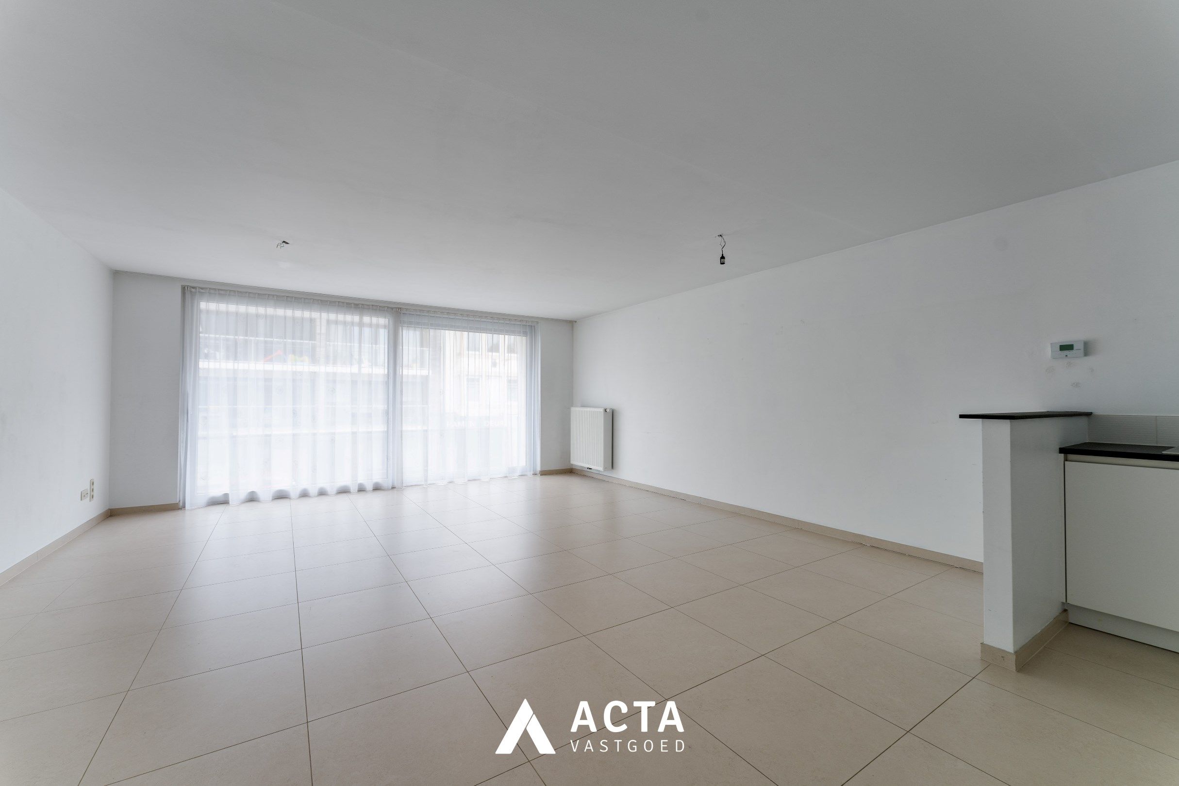 Nieuwbouwappartement met twee slaapkamers en terras in Mariakerke foto 2