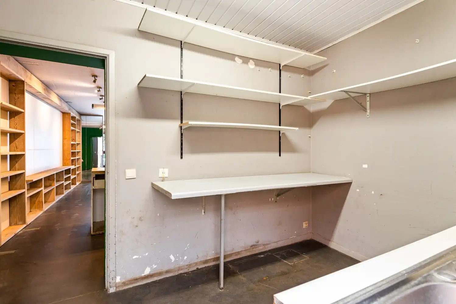 Handelshuis met 2 handelsruimtes en appartement in het hart van Wommelgem. foto 11